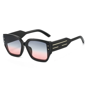 Classic black cat-eye sunglasses with blue-pink gradient lenses and gold metal accents
