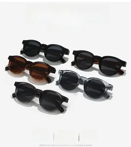 Detailed row of vintage round sunglasses in black, tortoise shell, and translucent gray