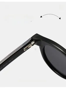 Close-up of durable metal hinge on retro round polarized acetate sunglasses