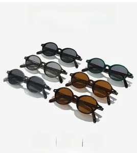Flat lay of vintage round sunglasses in six colors like black, tortoise, and army green