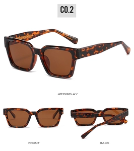 Detail view of square tortoiseshell polarized sunglasses with gold woven texture accents