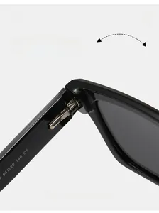 Macro detail of the durable metal hinge and size specs on black polarized sunglasses