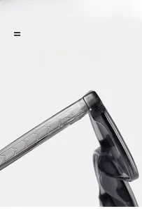 Macro detail of translucent grey glasses frame with textured metal core in the temple