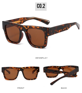 Détails macro de lunettes carrées écaille avec accents de branches en métal tressé
