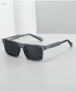 Detail of square sunglasses frame with metal wire core visible in transparent grey temples