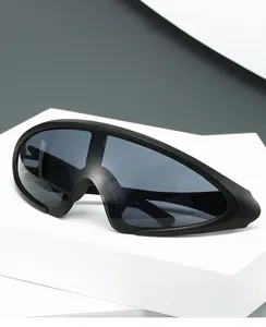 Detail of matte black wraparound sunglasses with seamless futuristic Y2K one-piece lens