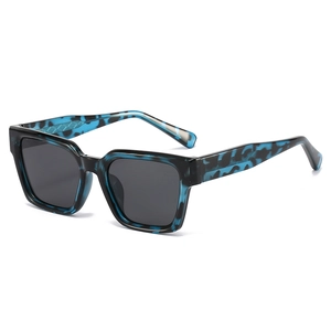 Modern square polarized sunglasses with blue tortoiseshell frames and woven temple details