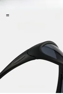 Detail of matte black cycling sunglasses showing streamlined frame and impact-resistant lens