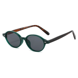 Retro round frame sunglasses with dark green finish and tortoise shell temples