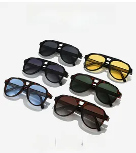 Detail of multi-color aviator sunglasses featuring stylish metal hinge mesh decorations