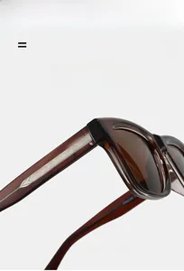 Detail view of square sunglasses showing silver diamond pattern inlay on temple arm