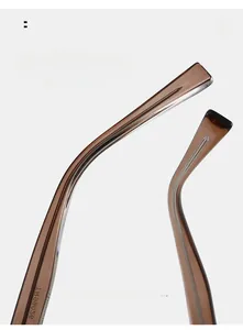 Detail of ergonomic curved temple arm with visible metal core in tea brown frame
