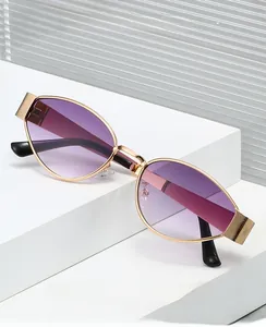 Detailed close-up of golden metal sunglasses frame with rose floral embossed hinge