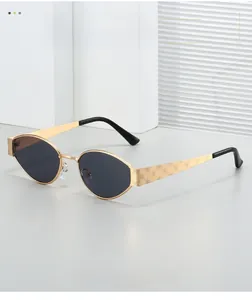 Detailed view of golden metal temples with intricate rose texture on oval sunglasses