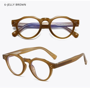 Detail of round jelly brown glasses frames with stylish silver triple rivet accents