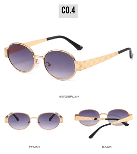 Detail view of oval sunglasses with purple gradient lenses and floral metal temples