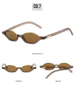 Detail view of cat eye sunglasses with brown semi-transparent frames and gold metal accents