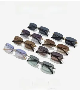 Macro shot of rimless square sunglasses set with gradient lenses and gold 'm' hinge details