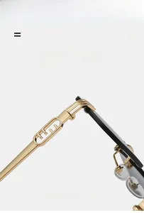 Macro detail of gold metal temples and soft nose pads on square rimless sunglasses
