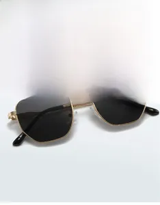 Detailed 45-degree angle view of gold geometric hexagonal metal sunglasses with model 9615