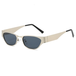 Vintage champagne gold cat-eye sunglasses with oval metal frames and dark lenses