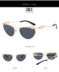 Detailansicht der goldenen Oval-Sonnenbrille mit Kristall-Strasssteinen und grauen Gläsern