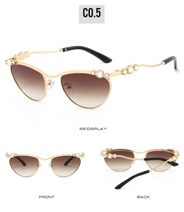 Details goldener Oval-Sonnenbrille mit kristallbesetzten Wellenbügeln und braunem Verlauf