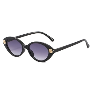 Cat eye kids sunglasses with black frame, purple gradient lenses and gold rose detail