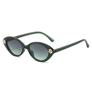 Green cat-eye sunglasses for children with elegant gold rose accents on white background