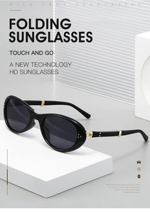 Detailansicht der schwarzen faltbaren Oval-Sonnenbrille mit goldenen Metallscharnieren