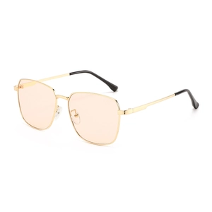 Retro oversized metal frame sunglasses with light orange lenses and golden finish