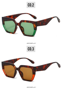 Détail à 45 degrés de lunettes de soleil carrées en écaille avec verres verts et bruns