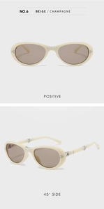 Details von ovalen beige Cat-Eye Sonnenbrillen mit champagnerfarbenem Rahmen und Gläsern