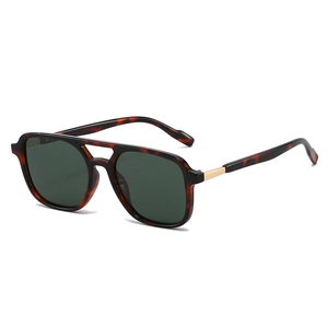 Classic tortoiseshell double-bridge sunglasses with dark green polarized lenses