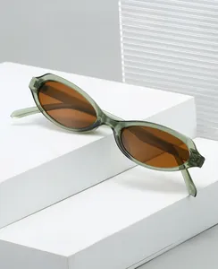 Detail view of retro oval sunglasses with green resin frames on a white geometric stand
