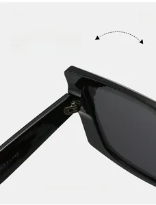 Macro view of durable metal hinge and specification codes on black square Y2K sunglasses