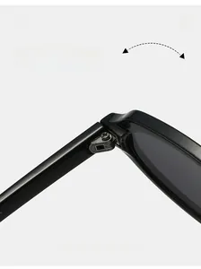 Detail shot of durable silver metal hinge on sleek black oval sunglasses frame