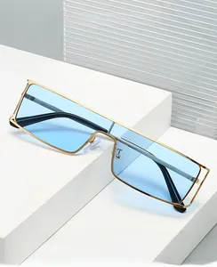 Detail of 2025 retro flat-top sunglasses with gold metal frame and light blue lenses