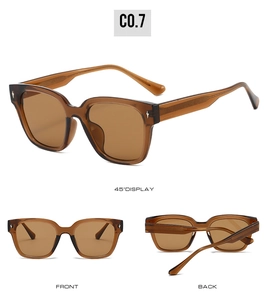 Close-up of translucent brown square frame sunglasses with metal cross star ornaments