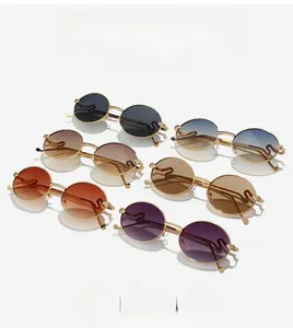 Detailed flat lay of retro metal oval sunglasses in multiple lens colors and gold frames