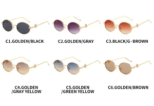 Collection of six vintage oval metal sunglasses with textured gold frames and assorted lenses