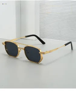 Detail shot of hexagonal gold metal frame sunglasses with dark gray polarized lenses