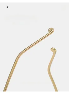 Detail of golden metal curved sunglasses temple tips for comfortable daily wear