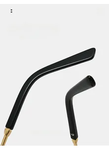 Detail of curved black sunglasses arms with premium gold metal hinges for comfortable fit