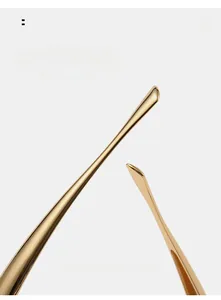 Close-up of curved polished gold metal eyewear temples for ergonomic comfort and premium style