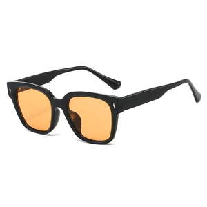 Modern TR90 sunglasses with black frame, orange lenses and silver star rivets