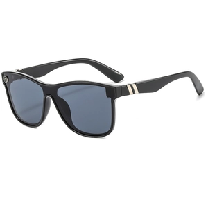 Modern oversized black sunglasses with gold metal accents and dark UV protective lenses