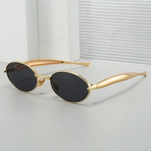 Retro oval metal frame sunglasses with gold finish and dark polarized lenses for fashion