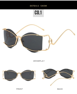 Vue détaillée de lunettes géométriques dorées avec logo M métallique sur la branche