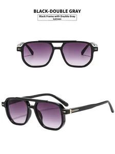 Detail of classic double-bridge pilot sunglasses with black frame and gradient lenses